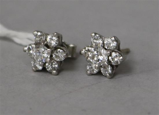 A pair of 18ct white gold and diamond cluster ear studs (one butterfly missing).